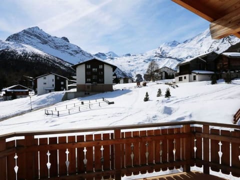 Sky, Cloud, Snow, Mountain, Property, White, Building, Window, Slope, House