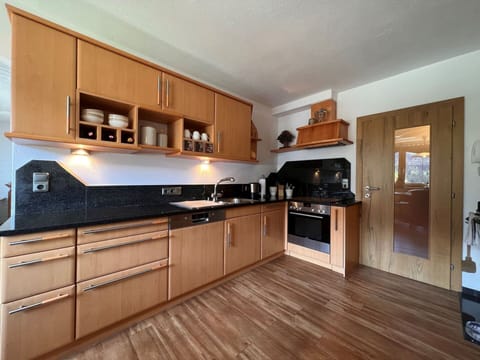 Cabinetry, Countertop, Property, Kitchen Stove, Kitchen Appliance, Kitchen, Microwave Oven, Building, Home Appliance, Interior Design