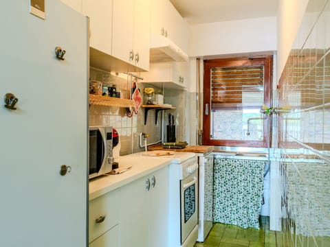 Cabinetry, Furniture, Countertop, Building, Kitchen, Kitchen Appliance, Interior Design, House, Wood, Shelf