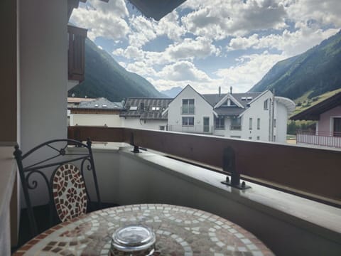 Cloud, Sky, Property, Building, Table, Window, Mountain, Tableware, Real Estate, Wood
