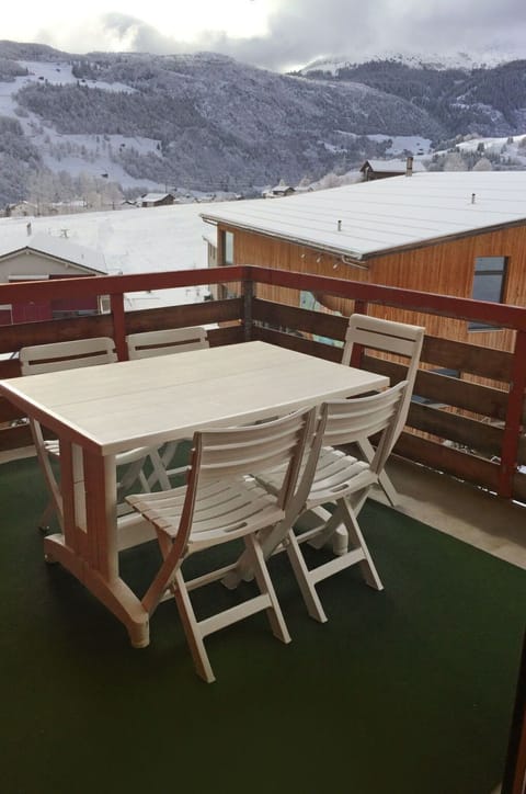 Cloud, Table, Sky, Furniture, Property, Mountain, Wood, Outdoor Furniture, Outdoor Table, Snow