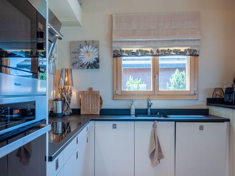 Tableware, Sky, Table, Property, Plant, Furniture, Building, Cloud, Dishware, Cup