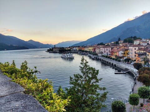 Water, Plant, Sky, Water Resources, Mountain, Building, Tree, Natural Landscape, Lake, Coastal And Oceanic Landforms