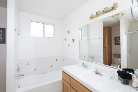 Combined shower/tub, hair dryer, towels, soap