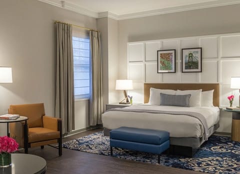 Sink into plush pillows beneath warm, glowing bedside lamps.