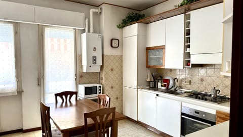 Fridge, oven, dining tables