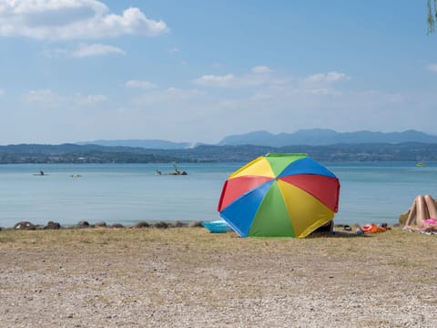 Water, Sky, Cloud, Umbrella, Beach, Coastal And Oceanic Landforms, Tree, Shade