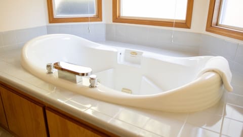 Jetted tub, hair dryer, towels, soap