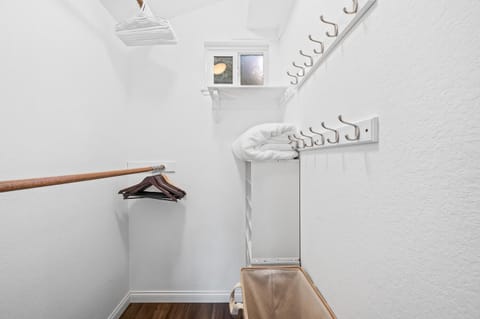 Primary bedroom walk-in closet