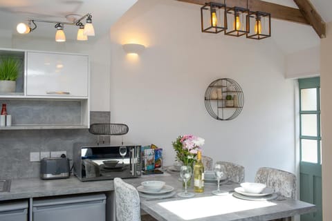 Front door leading to kitchen area. Original A frame beams