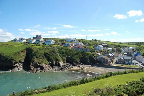 The small sandy cove at Little Haven with the village in view