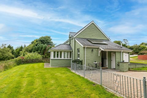 Outside of the property with driveway and lawn