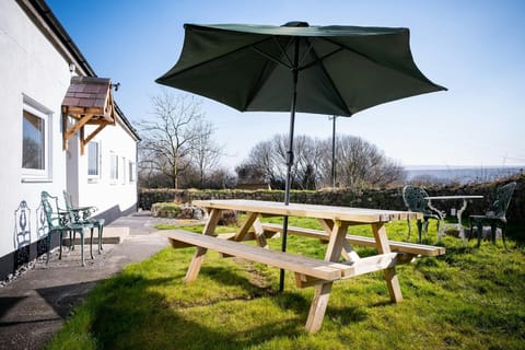 Garden with picnic bench and parasol
