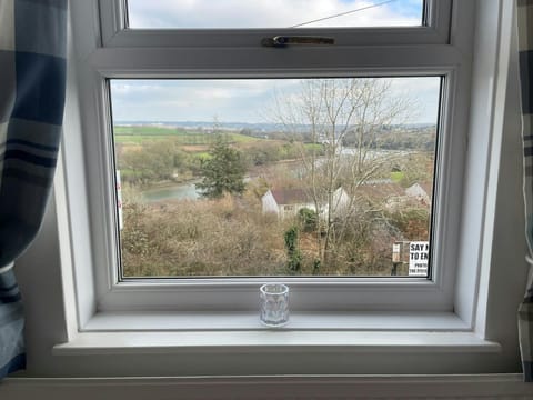 Views from the bedroom window overlooking the village and river
