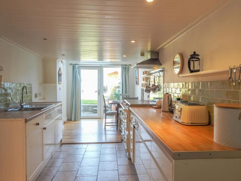 Kitchen floor cabinets, toaster, kettle, sink