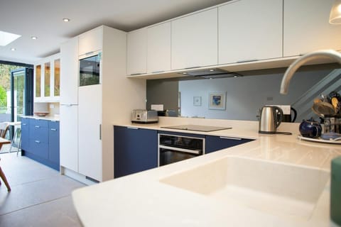 Kitchen with electric hob, oven and microwave
