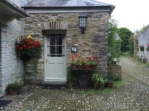 The Creamery with baskets of flowers outside the door