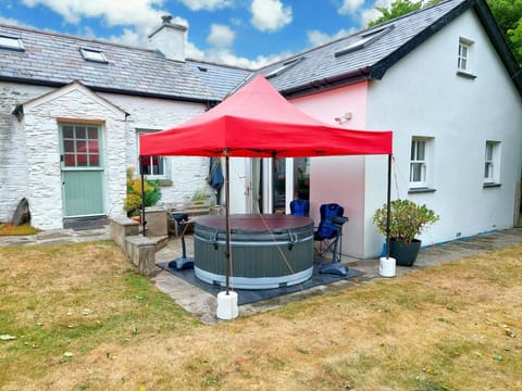 Hired hot tub on the patio under a gazebo