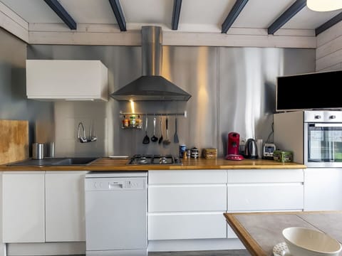 Countertop, Cabinetry, Property, Kitchen Sink, Kitchen, Kitchen Appliance, Kitchen Stove, Lighting, Wood, Interior Design