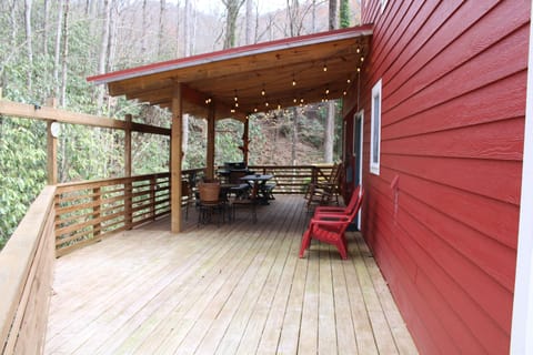 Outdoor and covered deck area overlooking creek.