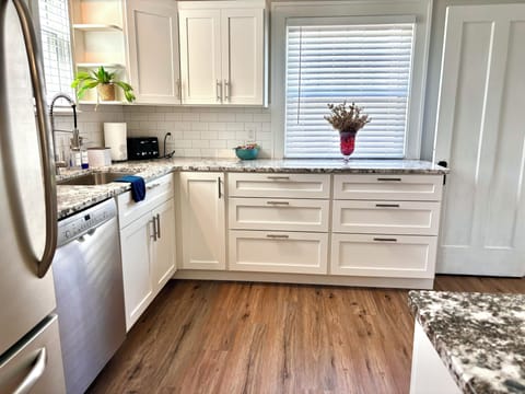 Amish-built cabinetry, granite countertops and sleek stainless steel appliances