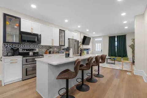 The stylish open concept kitchen perfect for a social cooking and dining experience
