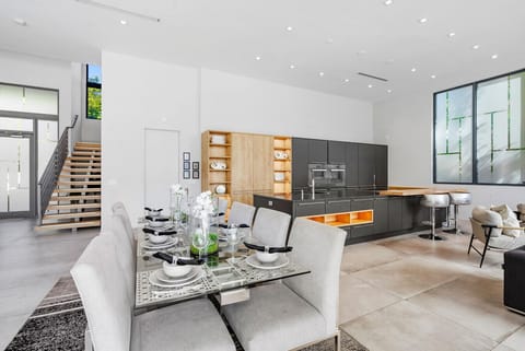 Bright double height space with indoor outdoor flow