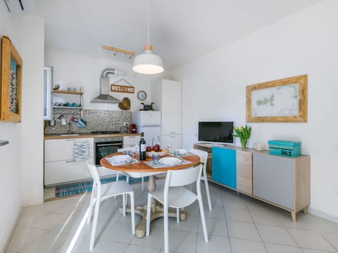 Table, Furniture, Chair, Cabinetry, Interior Design, Orange, Flooring, Kitchen, Floor, Houseplant