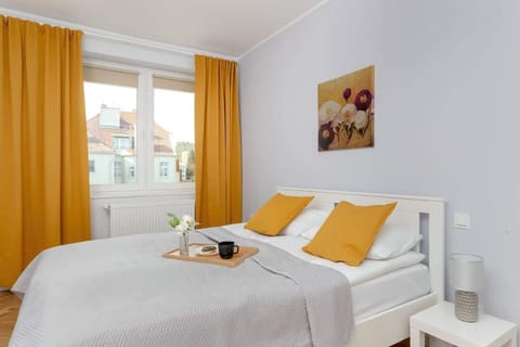The cosy bedroom features a luxurious double bed and ample storage.