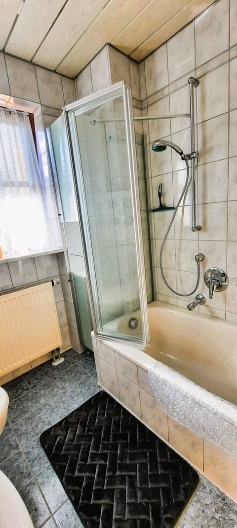 Combined shower/tub, hair dryer, towels, soap