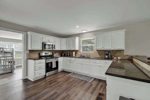 Fully equipped kitchen with stainless steel appliances.