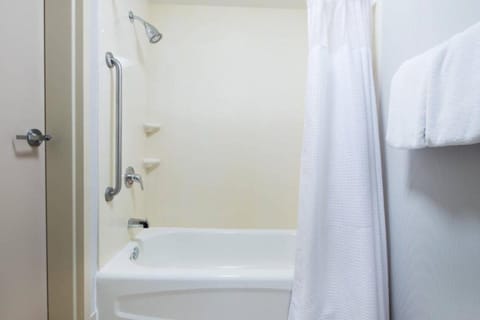 Combined shower/tub, hair dryer, towels, soap