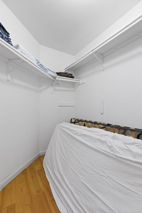 Large master closet includes 2 additional roll away beds for guest use.
