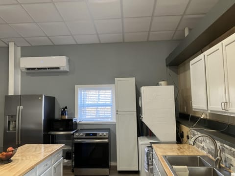 Stainless appliances, full frig, microwave, stackable washer/dryer.