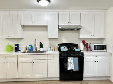 Fridge, microwave, cookware/dishes/utensils