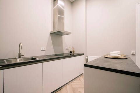 The fully equipped shared kitchen space, featuring modern appliances for a comfortable cooking experience.