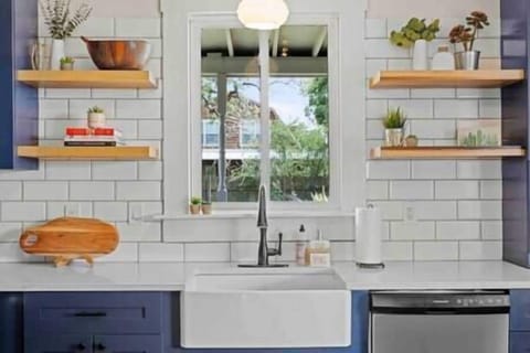 The kitchen is equipped with a Full-sized farmhouse sink and dishwasher