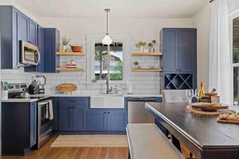 Fully stocked kitchen with utensils, coffee maker, Ninja blender, and more!