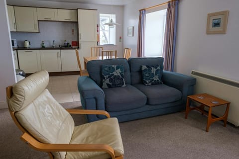 Lounge area with sofa and armchair