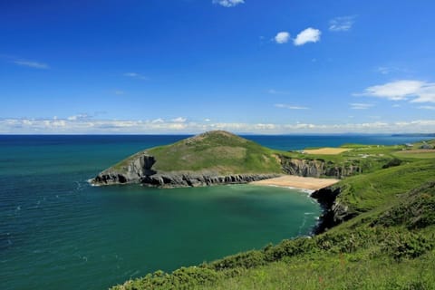 View from the coastal path towards the small sandy beach at Mwnt
