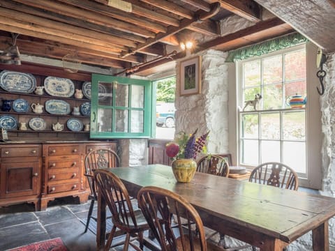 Kitchen with dining table and chairs, stable door, large dresser with crockery