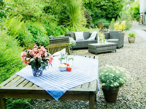 Courtyard garden with table and chairs and sating area