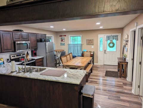 Full-size kitchen with oven, stove, microwave, dishwasher, refrigerator, freezer