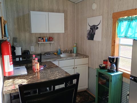 High top table and larger refrigerator.