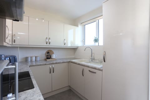 Fully equipped kitchen area on first floor