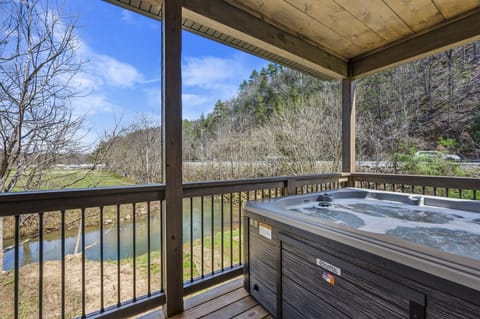 Cabin By The Creek's bubbling hot tub
