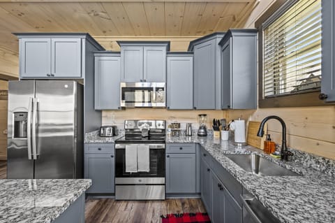 Cabin By The Creek's fully equipped kitchen