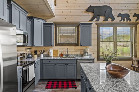 Cabin By The Creek's fully equipped kitchen
