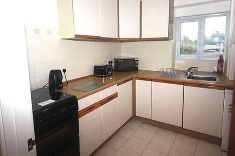 Kitchen with oven, grill, hob, kettle, toaster, microwave, dishwasher, fridge