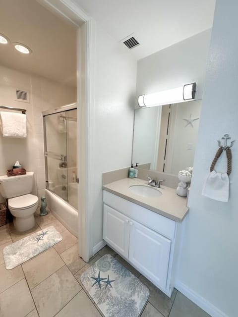 Combined shower/tub, hair dryer, towels, soap